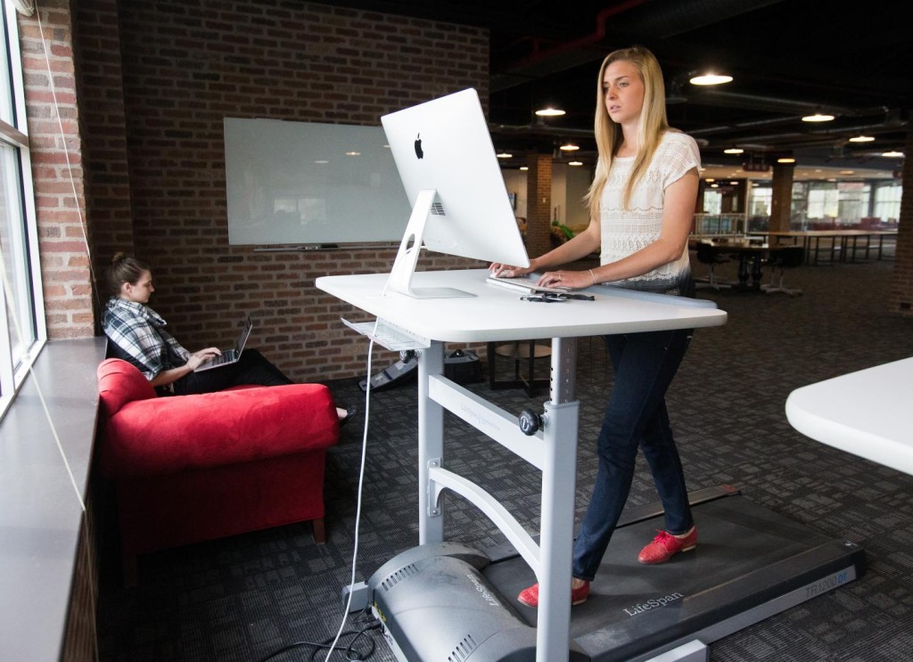 An employee working at a treadmill desk. (Jaren Wilkey/BYU)