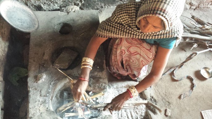 A University of Iowa researcher created an inexpensive metal insert for primitive cookstoves, such as this one used in a remote village in India, that may decrease global warming and potentially save the lives of thousands of women and children. Courtesy of H.S. Udaykumar and University of Iowa