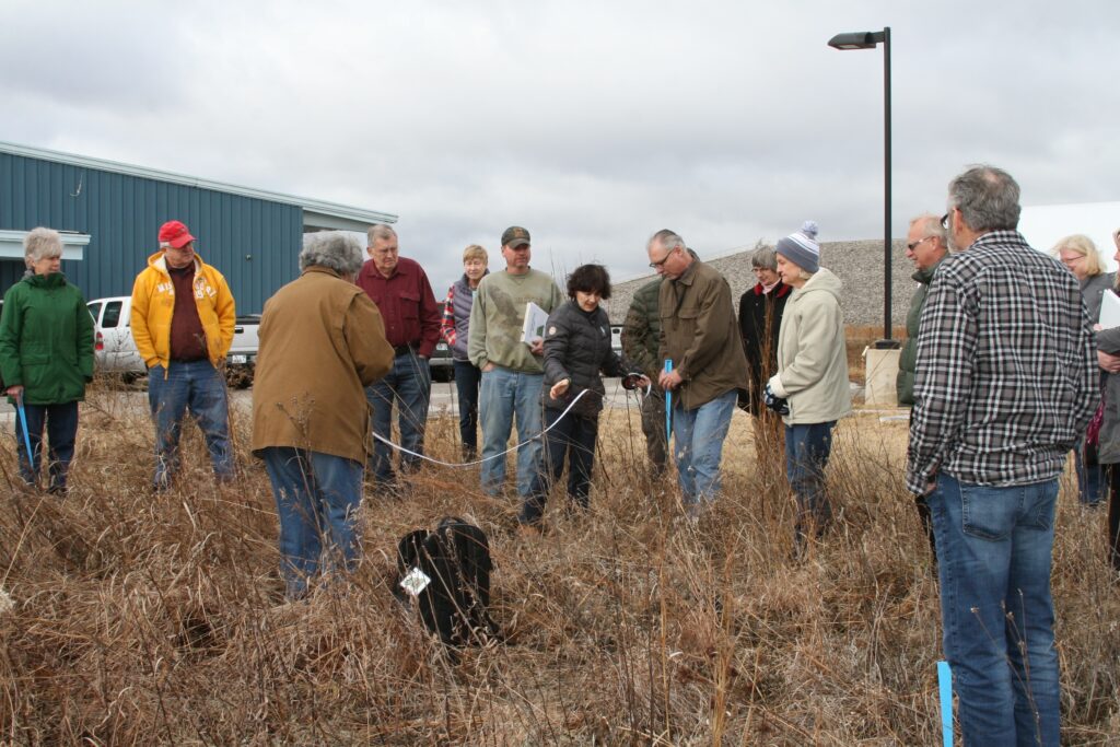 A large group of volunteers taking ground measurements as part of the MO Dirt program.