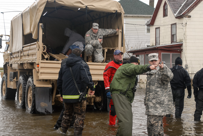 Members from several Maryland National Guard units are deployed to Crisfield, Md., to assist local authorities with house-to-house evacuations on Oct. 30, 2012. Guard members helped first responders evacuate senior citizens, families and children in the wake of Hurricane Sandy.