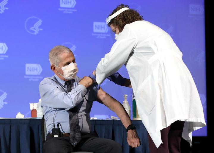 Dr. Anthony Fauci, Director of the National Institute of Allergy and Infectious Diseases, receives the Moderna COVID-19 vaccine at the HHS/NIH COVID-19 Vaccine Kick-Off event at NIH on 12/22/20. (NIH)