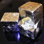 Hiddlen value of fool's gold: Macro photo of three Iron pyrite cubes by Stuart Rankin