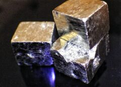 Hiddlen value of fool's gold: Macro photo of three Iron pyrite cubes by Stuart Rankin