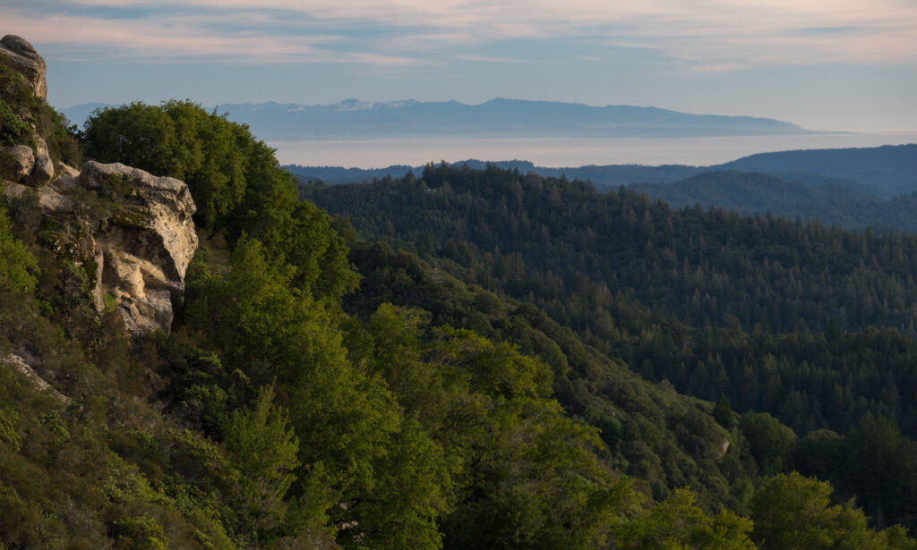 From Castle Rock State Park, looking out over the Santa Cruz mountains towards the south. Monterey Bay is visible at the top, with Monterey / Pacific Grove at the upper right. (Photo by 