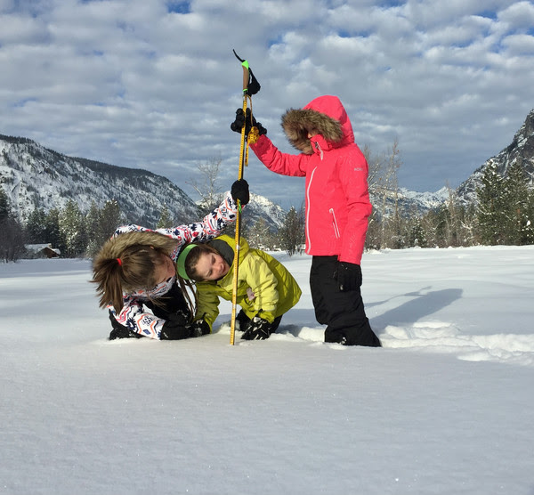 Children measuring the depth of snow. Image credit: David Hill, Oregon State University 